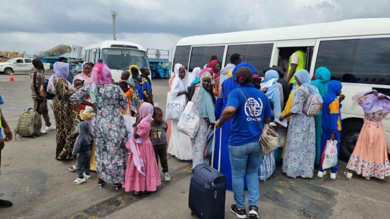 Returnees-boarding-bus-at-the-airport-768x432